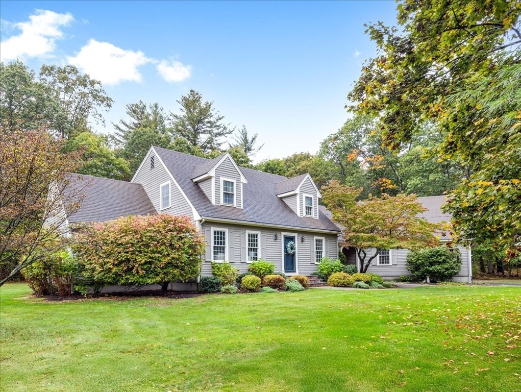 74 Granite Street Walpole, MA 02052 - Photo 1 of 40 a front view of a house with a garden