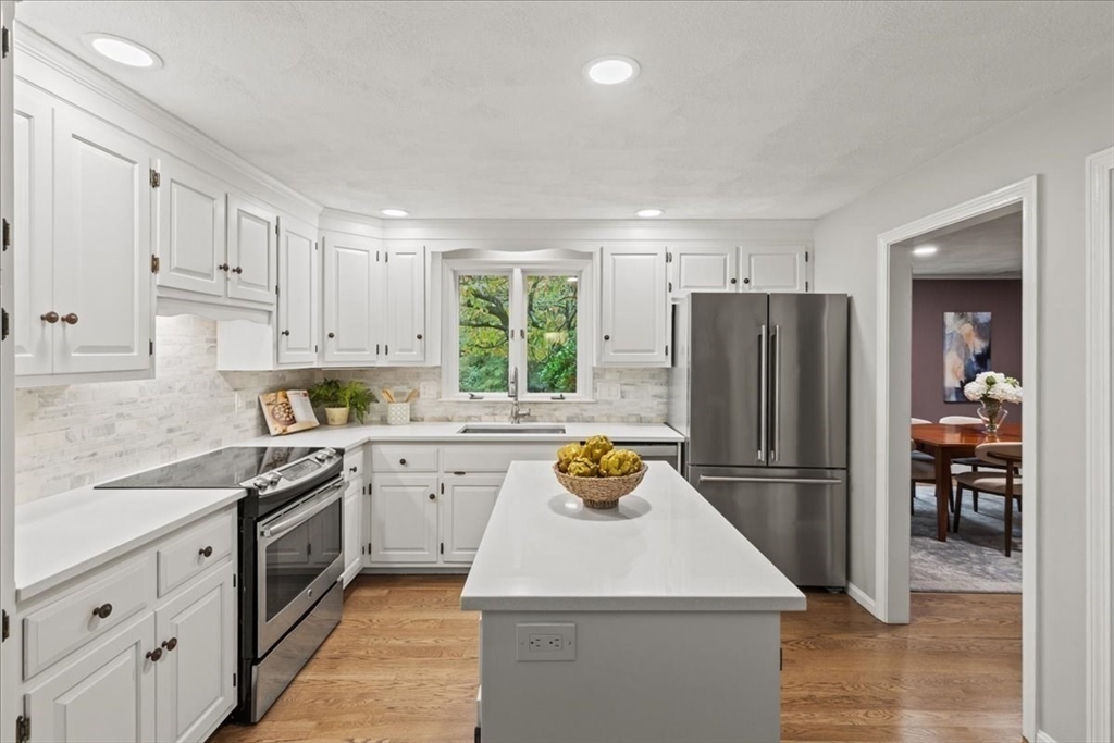 74 Granite Street Walpole, MA 02052 - Photo 13 of 40 a kitchen with a white stove top oven and refrigerator