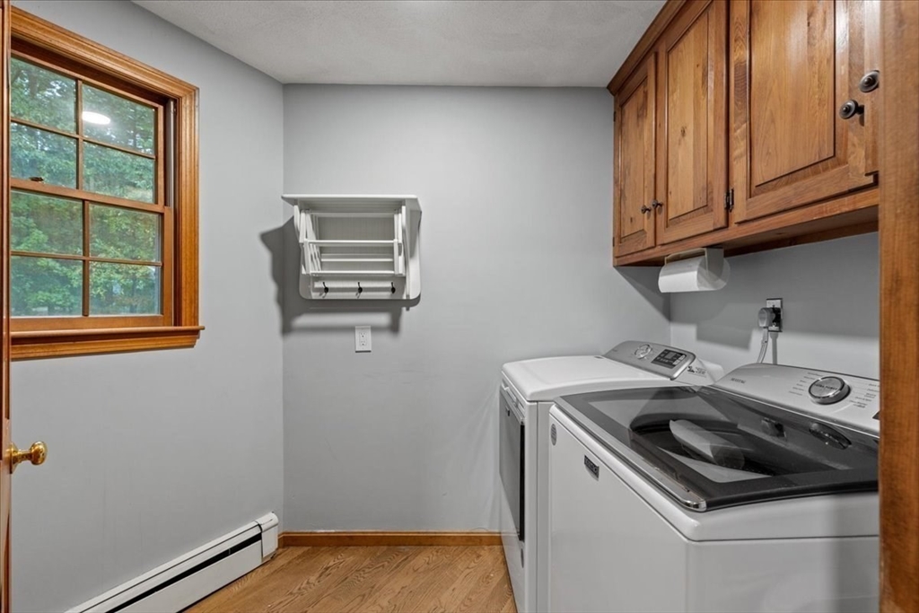 74 Granite Street Walpole, MA 02052 - Photo 16 of 40 a utility room with dryer and washer