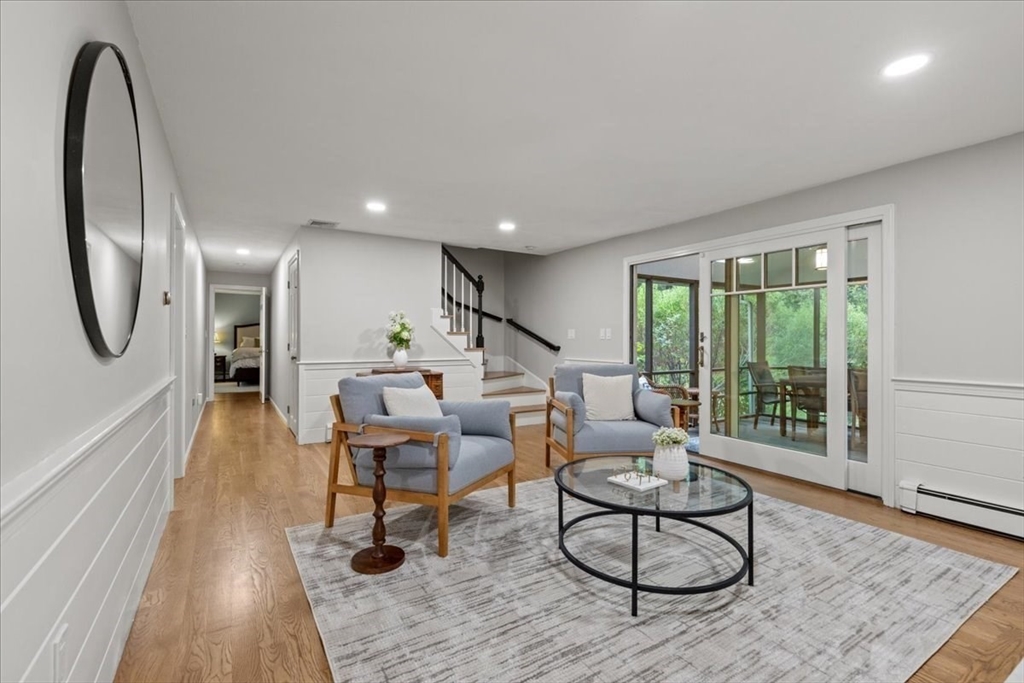 74 Granite Street Walpole, MA 02052 - Photo 17 of 40 a living room with furniture a large window and kitchen view
