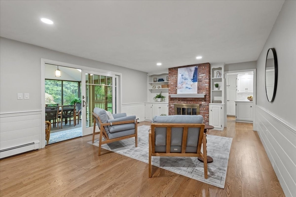74 Granite Street Walpole, MA 02052 - Photo 18 of 40 a living room with furniture and a wooden floor