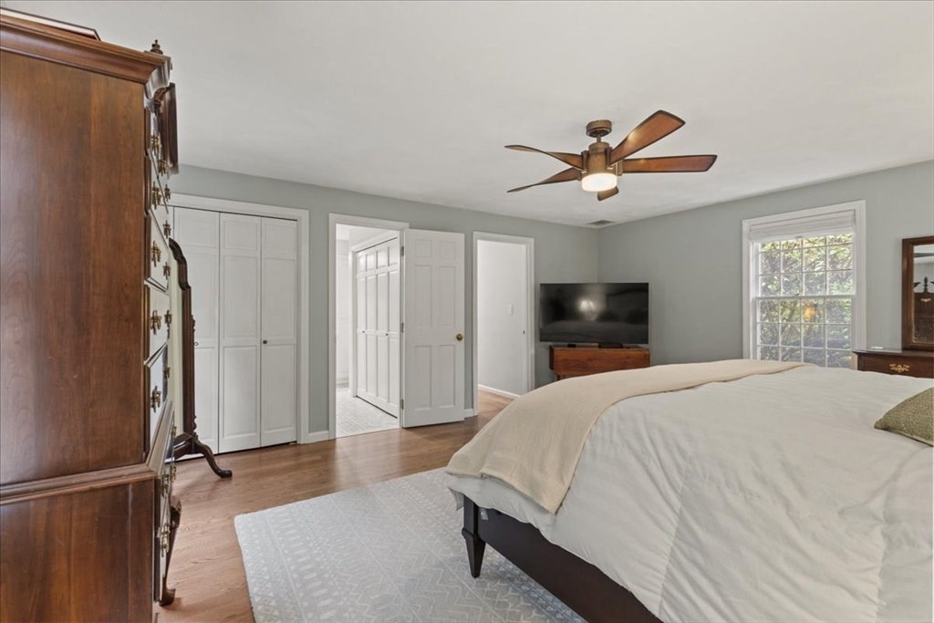74 Granite Street Walpole, MA 02052 - Photo 22 of 40 a bedroom with a bed and a flat screen tv