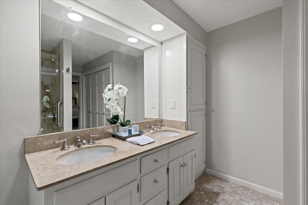 74 Granite Street Walpole, MA 02052 - Photo 23 of 40 a bathroom with a granite countertop double vanity sink and a mirror