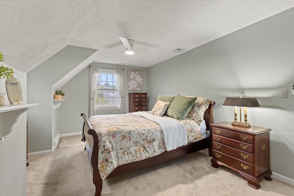 74 Granite Street Walpole, MA 02052 - Photo 27 of 40 a bed room with a bed and a window