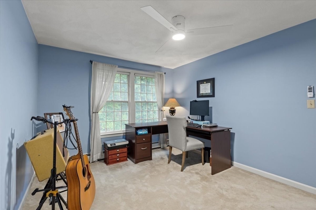 74 Granite Street Walpole, MA 02052 - Photo 29 of 40 a view of a workspace with furniture and a window