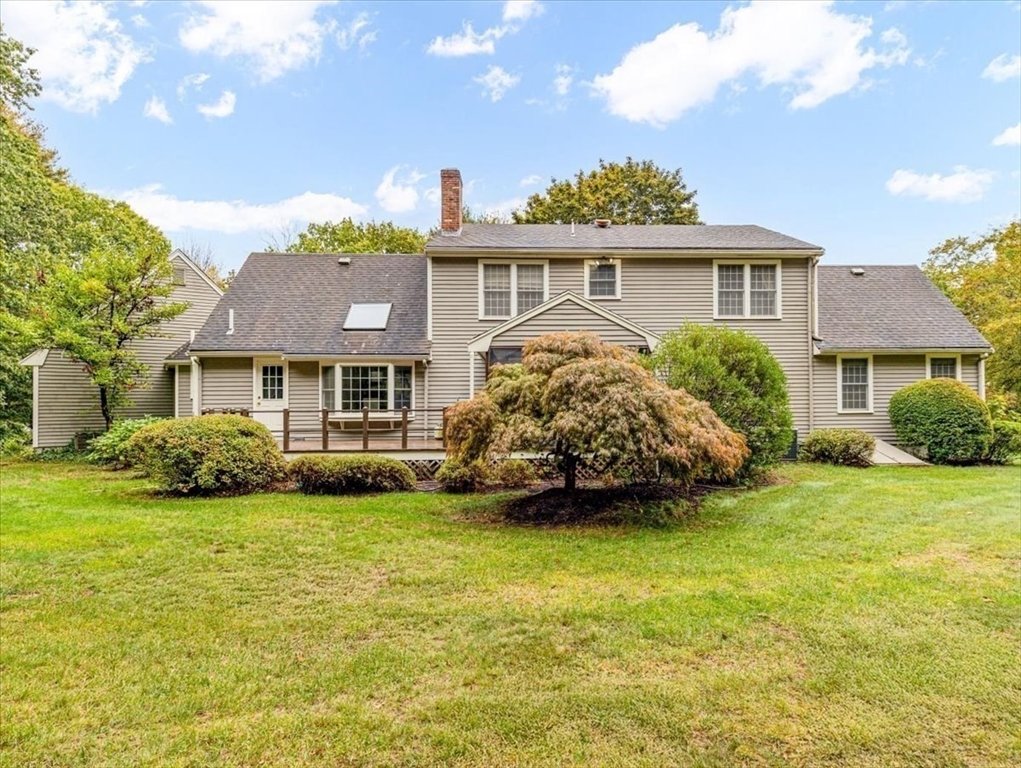74 Granite Street Walpole, MA 02052 - Photo 33 of 40 a front view of a house with a garden