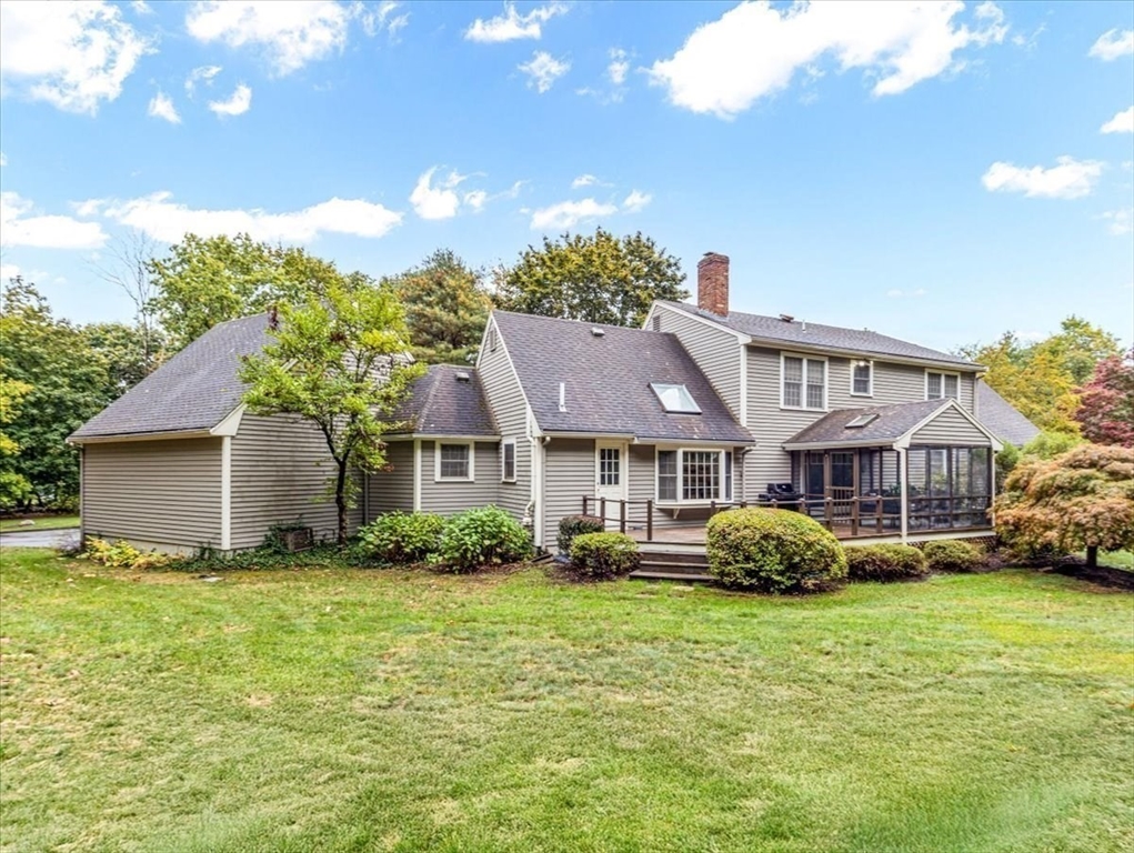 74 Granite Street Walpole, MA 02052 - Photo 34 of 40 a front view of a house with a garden