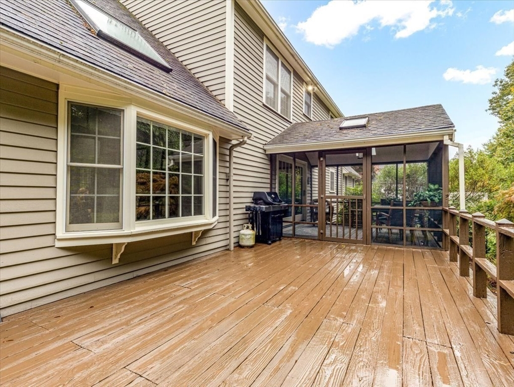74 Granite Street Walpole, MA 02052 - Photo 35 of 40 a view of a house with sitting area and wooden floor