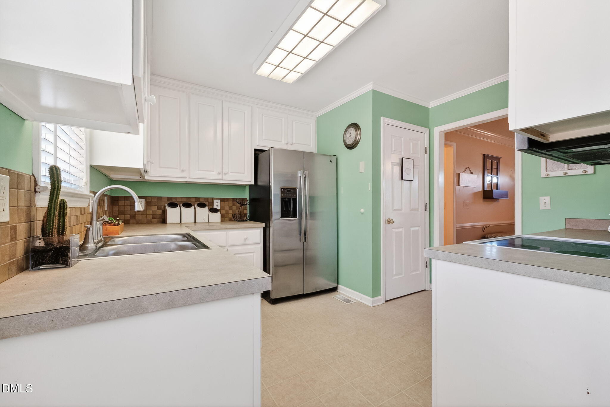 305 River Birch Run Coats, NC 27521 - Photo 13 of 36 a kitchen with stainless steel appliances granite countertop a refrigerator a stove and a sink