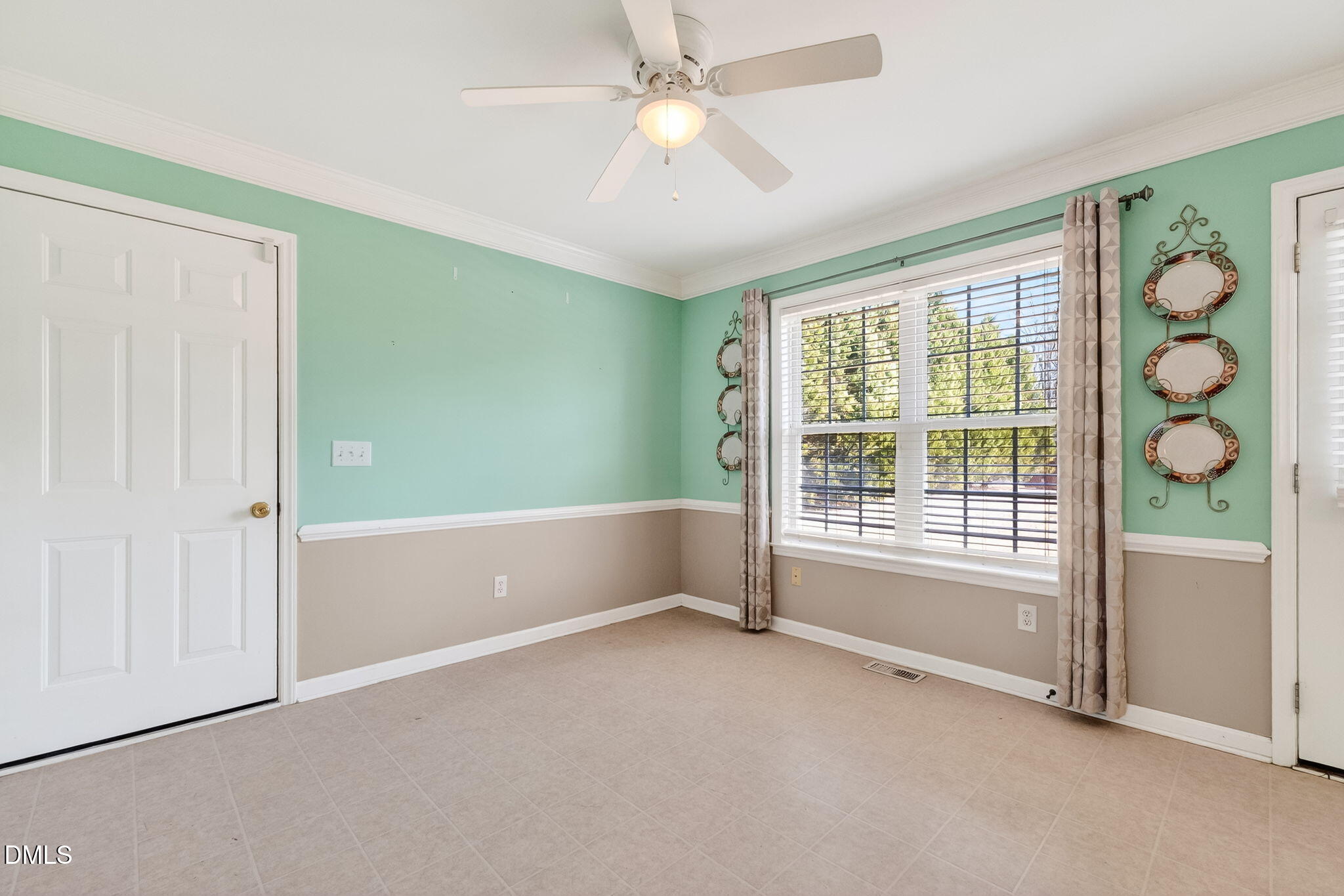 305 River Birch Run Coats, NC 27521 - Photo 16 of 36 a view of an empty room with windows and chandelier fan