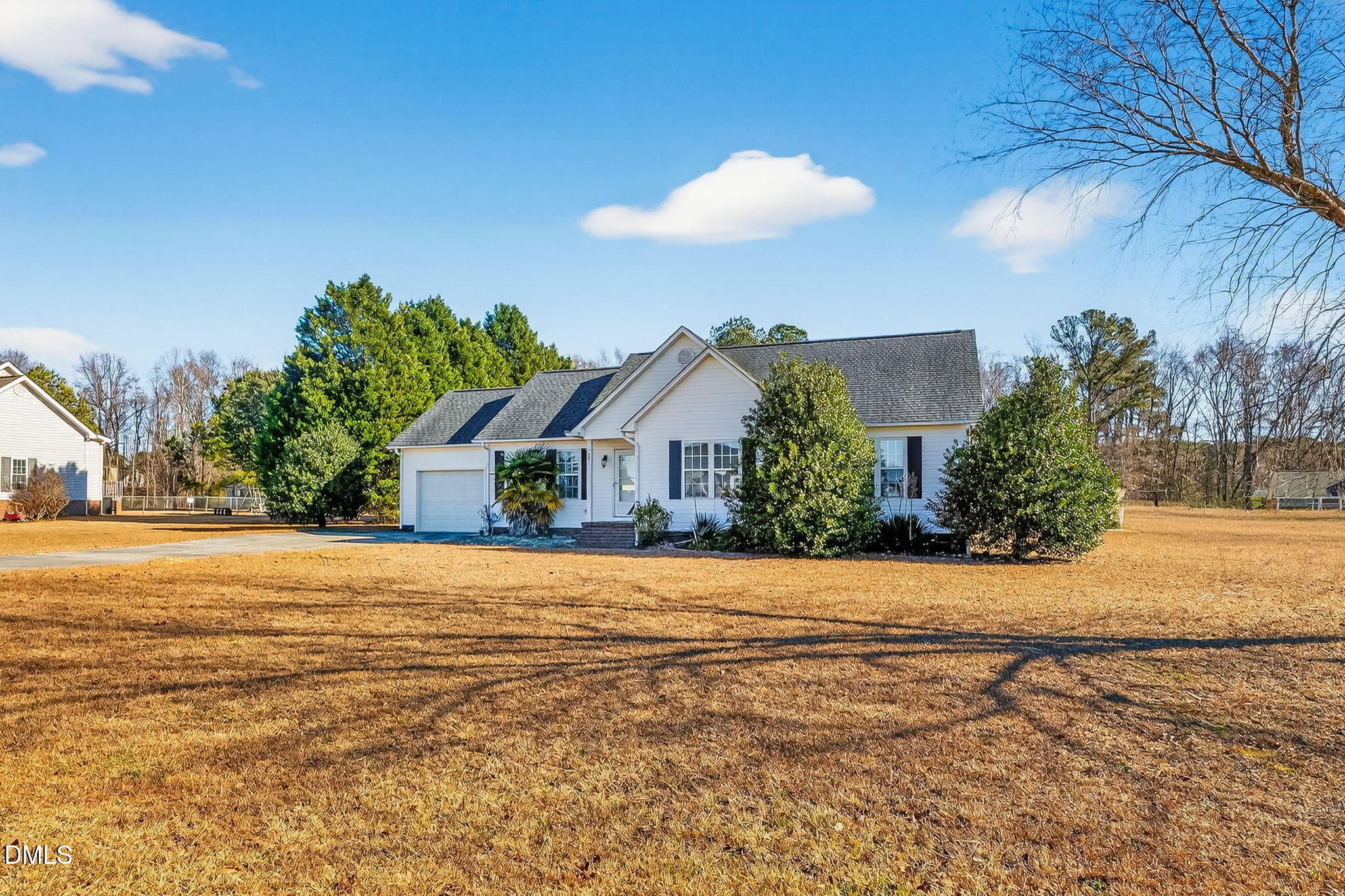 305 River Birch Run Coats, NC 27521 - Photo 2 of 36 a front view of a house with a yard and mountain view