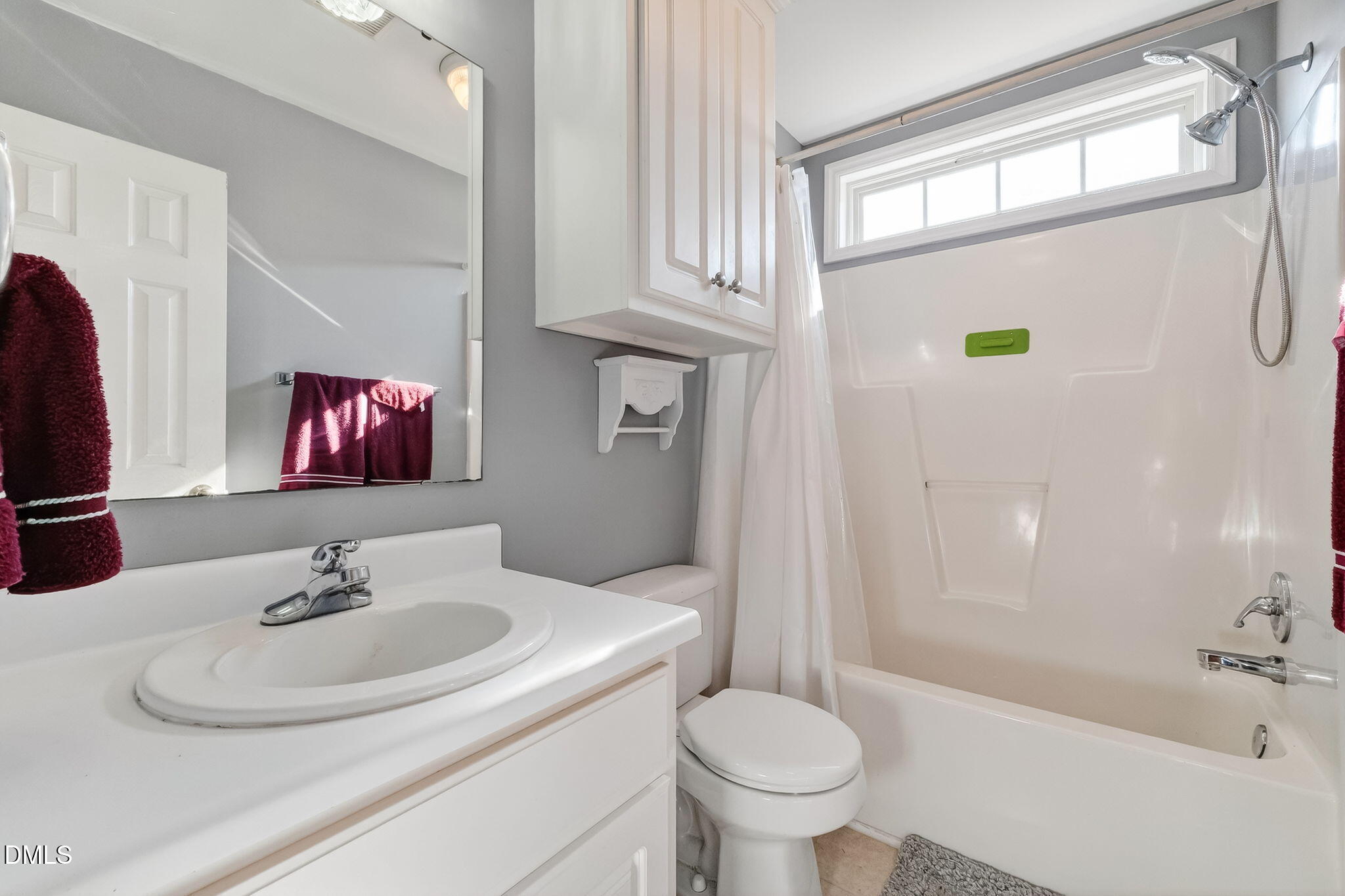 305 River Birch Run Coats, NC 27521 - Photo 23 of 36 a bathroom with a sink and a mirror