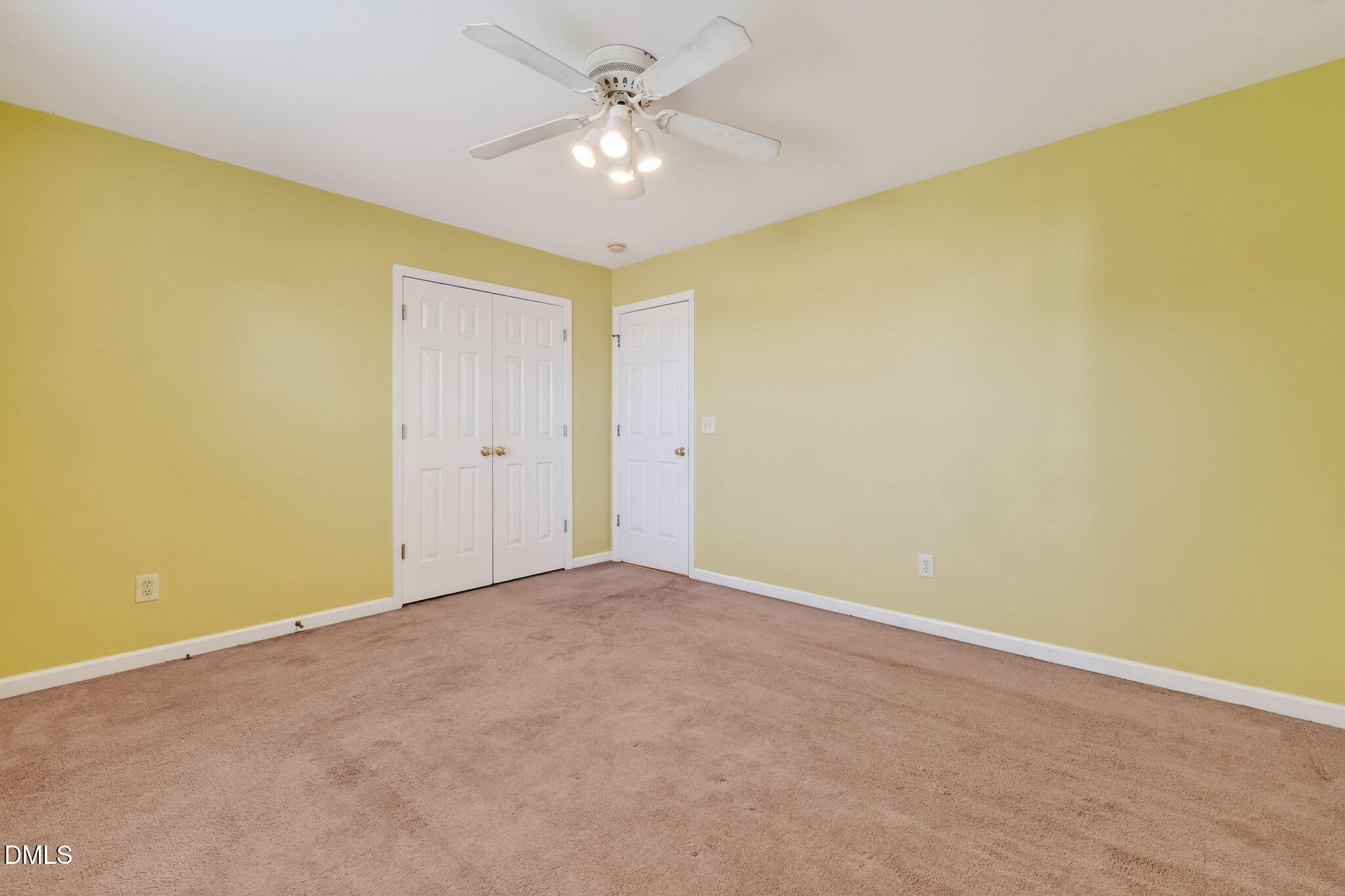 305 River Birch Run Coats, NC 27521 - Photo 29 of 36 an empty room with a ceiling fan and a window