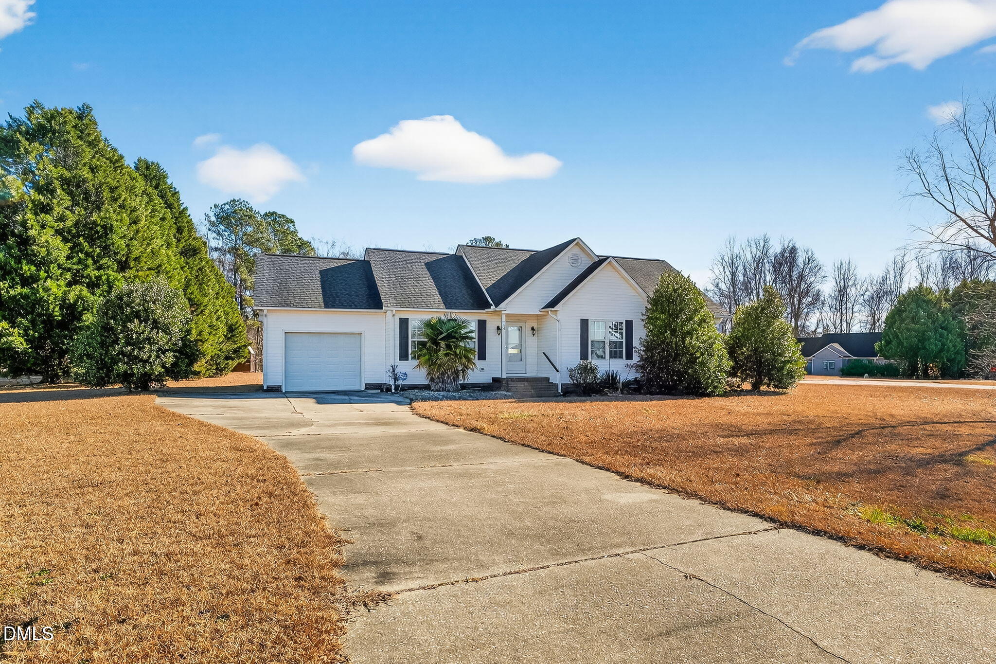 305 River Birch Run Coats, NC 27521 - Photo 3 of 36 a front view of a house with a yard and garage