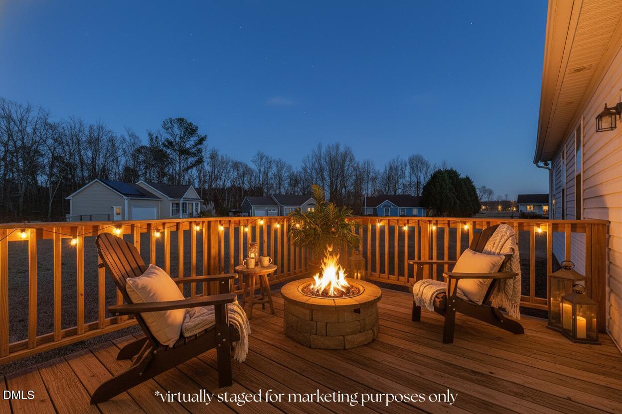 305 River Birch Run Coats, NC 27521 - Photo 31 of 36 a view of a chairs and table in backyard