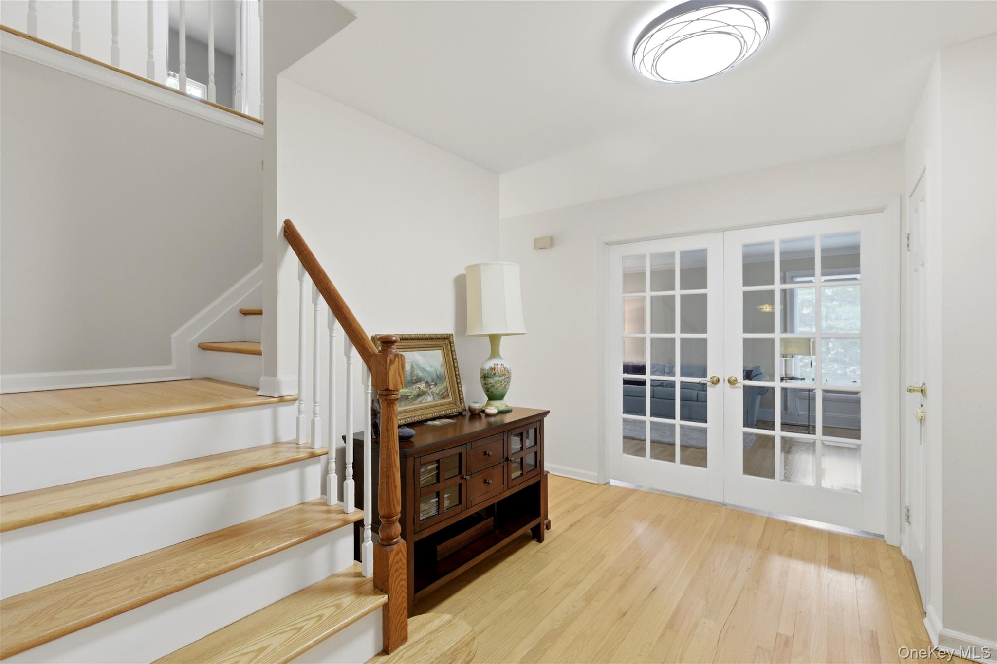 7 Gun Path Setauket, NY 11733 - Photo 5 of 34 a view of a bedroom with wooden floor and stairs