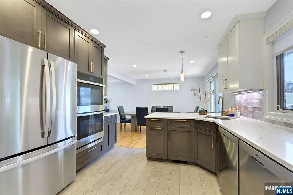 514 Rutland Avenue Teaneck, NJ 07666 - Photo 13 of 40 a kitchen with lots of counter top space and stainless steel appliances
