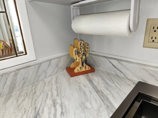 a view of a patio with table and chairs