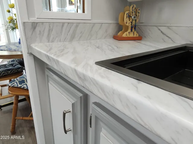 a balcony with table and chairs