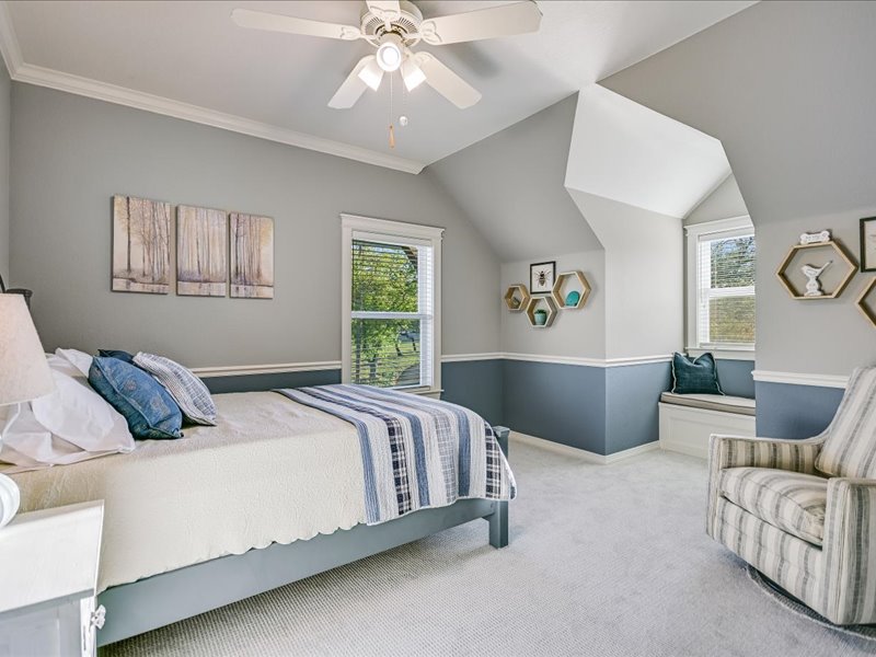 14036 Timberline Trail Austin, TX 78737 - Photo 18 of 40 Bedroom featuring light colored carpet, a ceiling fan, and lofted ceiling