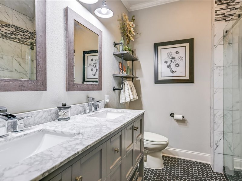 14036 Timberline Trail Austin, TX 78737 - Photo 20 of 40 Full bath with a marble finish shower, double vanity, crown molding, solar tube for extra light.