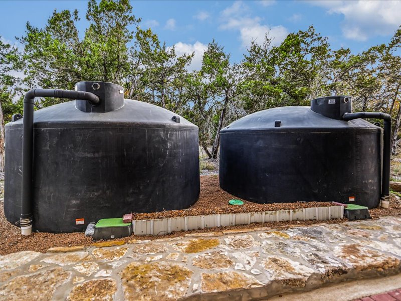 14036 Timberline Trail Austin, TX 78737 - Photo 38 of 40 14,500 gallons of rainwater collection tanks on the property that service guest house, chicken coop and wildlife..