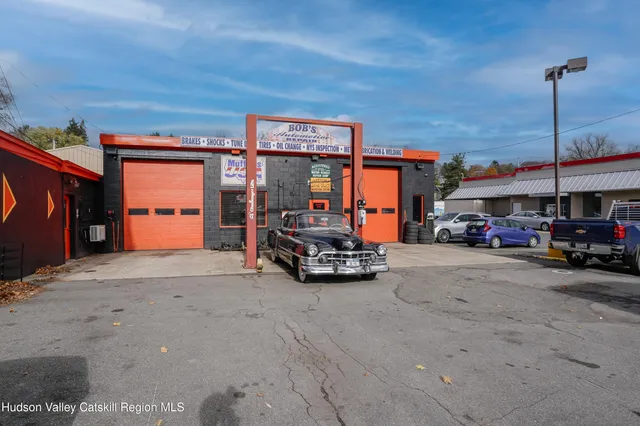 a view of a cars park in front of building