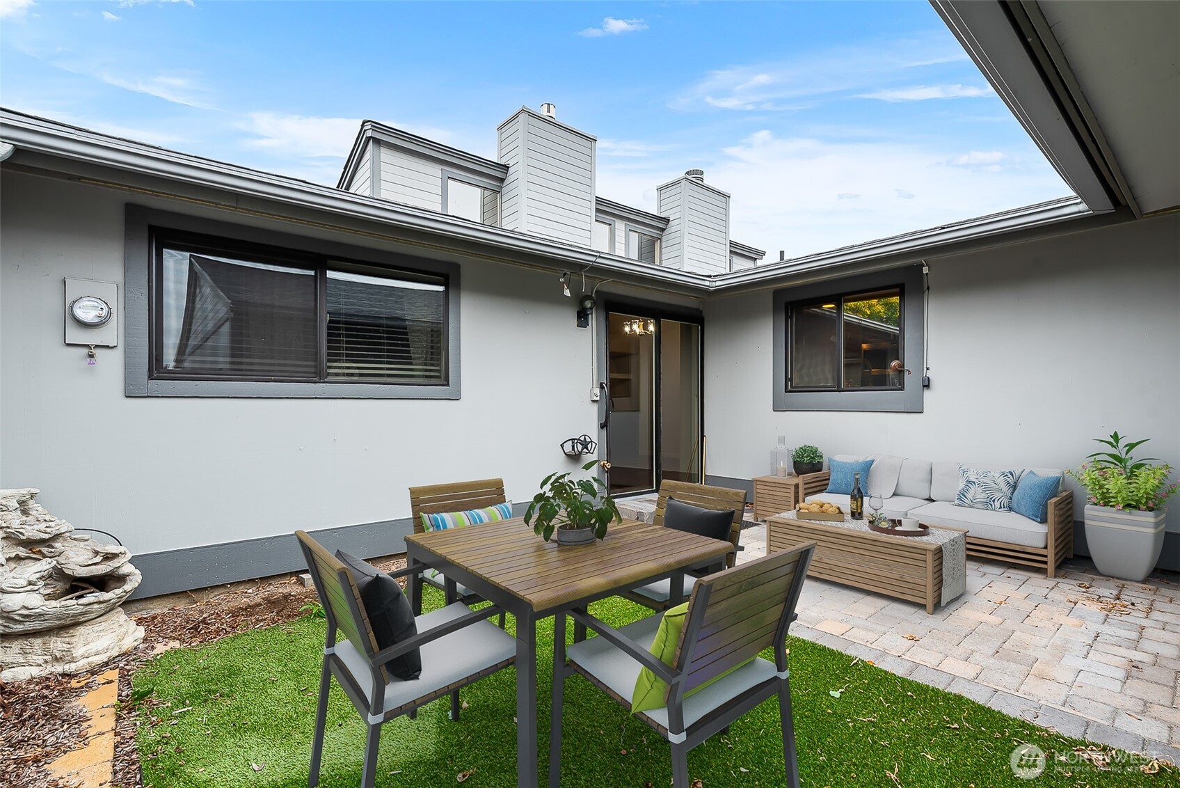 1310 Castlerock Avenue, Unit 19 Wenatchee, WA 98801 - Photo 12 of 17 a backyard of a house with table and chairs