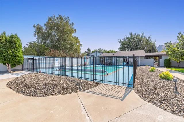 a front view of a house with a yard and a garage