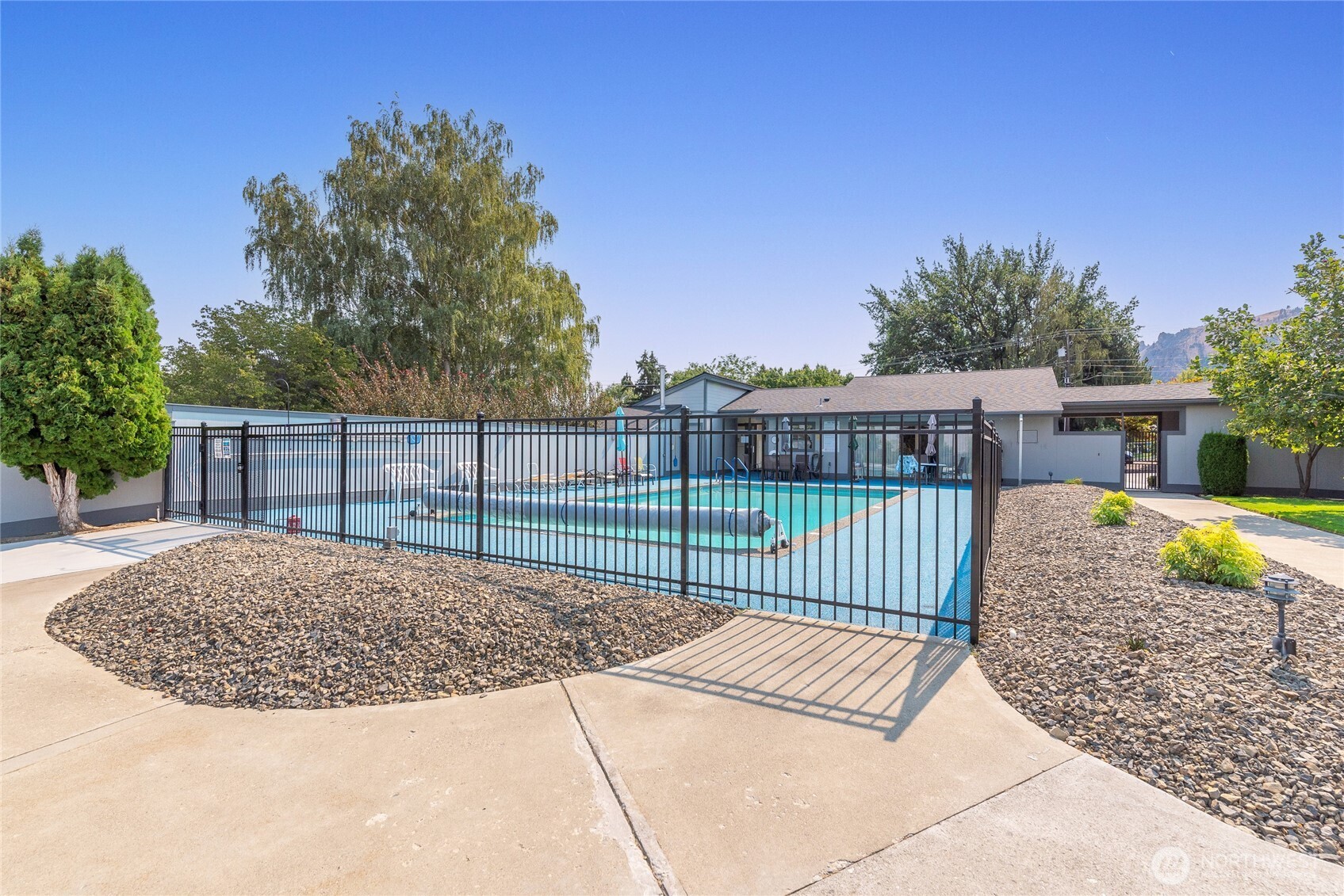 1310 Castlerock Avenue, Unit 19 Wenatchee, WA 98801 - Photo 16 of 17 a view of a house with a wooden fence