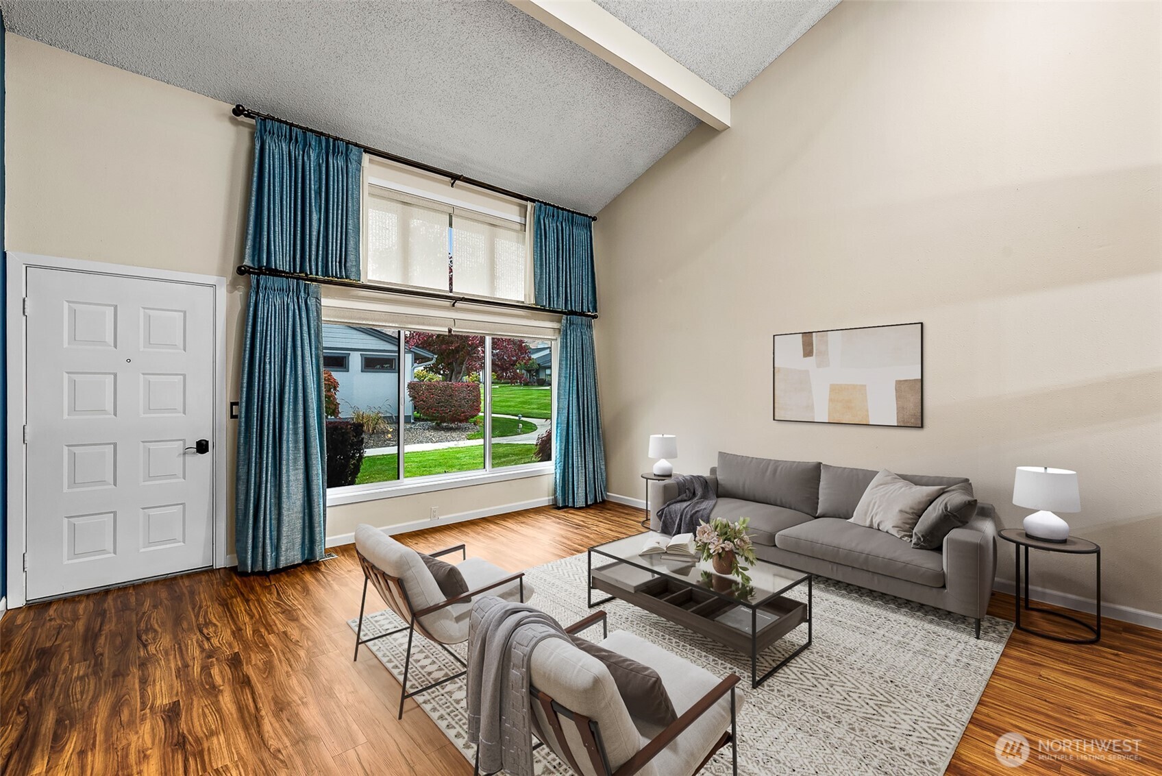 1310 Castlerock Avenue, Unit 19 Wenatchee, WA 98801 - Photo 2 of 17 a living room with furniture and a large window