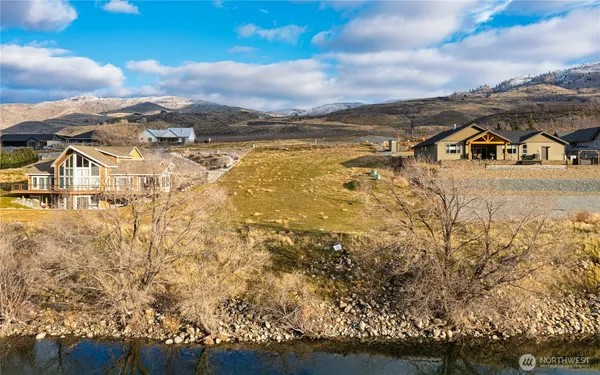 an aerial view of residential houses with yard