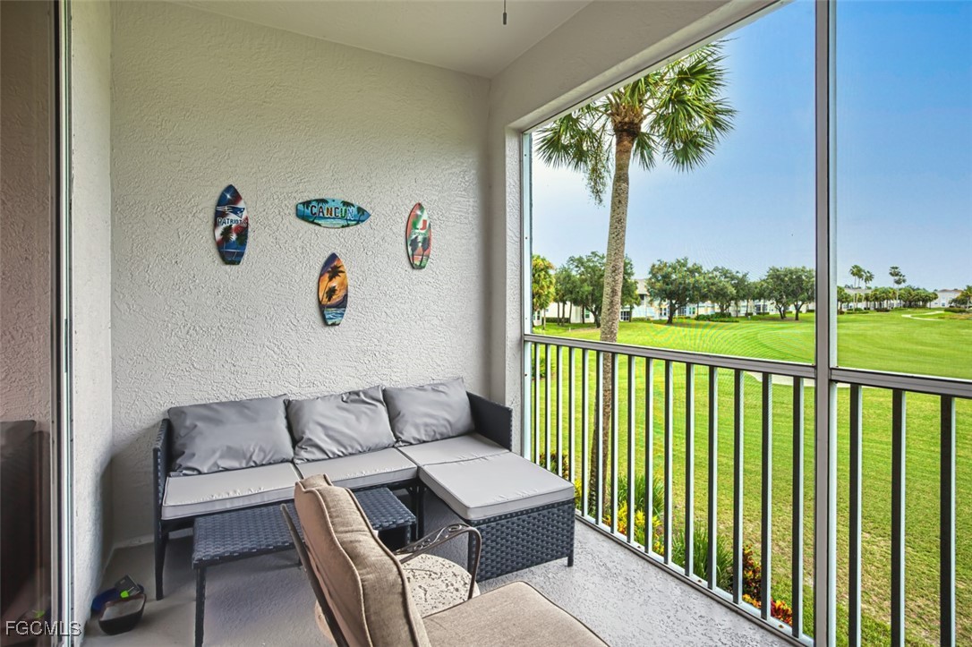 10275 Bismark Palm Way, Unit 1124 Fort Myers, FL 33966 - Photo 20 of 50 a view of a patio with a table and chairs