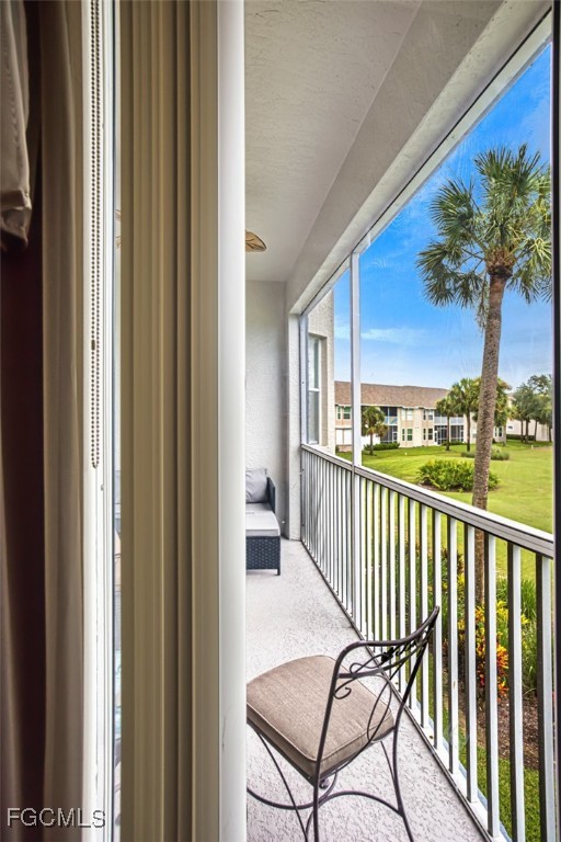 10275 Bismark Palm Way, Unit 1124 Fort Myers, FL 33966 - Photo 21 of 50 a view of a balcony with furniture
