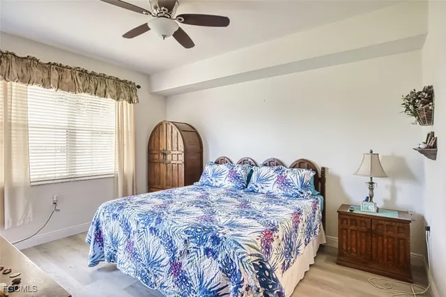 a bedroom with a bed and a table in it