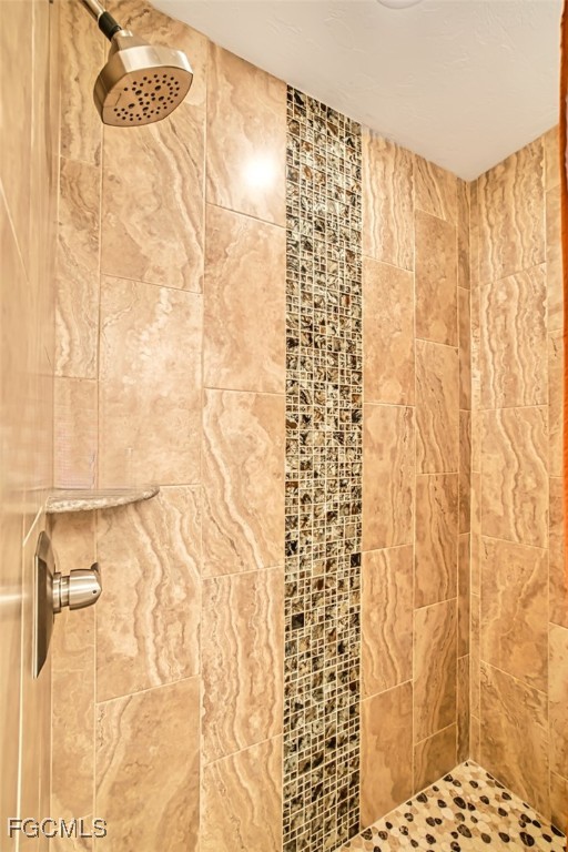 10275 Bismark Palm Way, Unit 1124 Fort Myers, FL 33966 - Photo 31 of 50 a bathroom with a shower