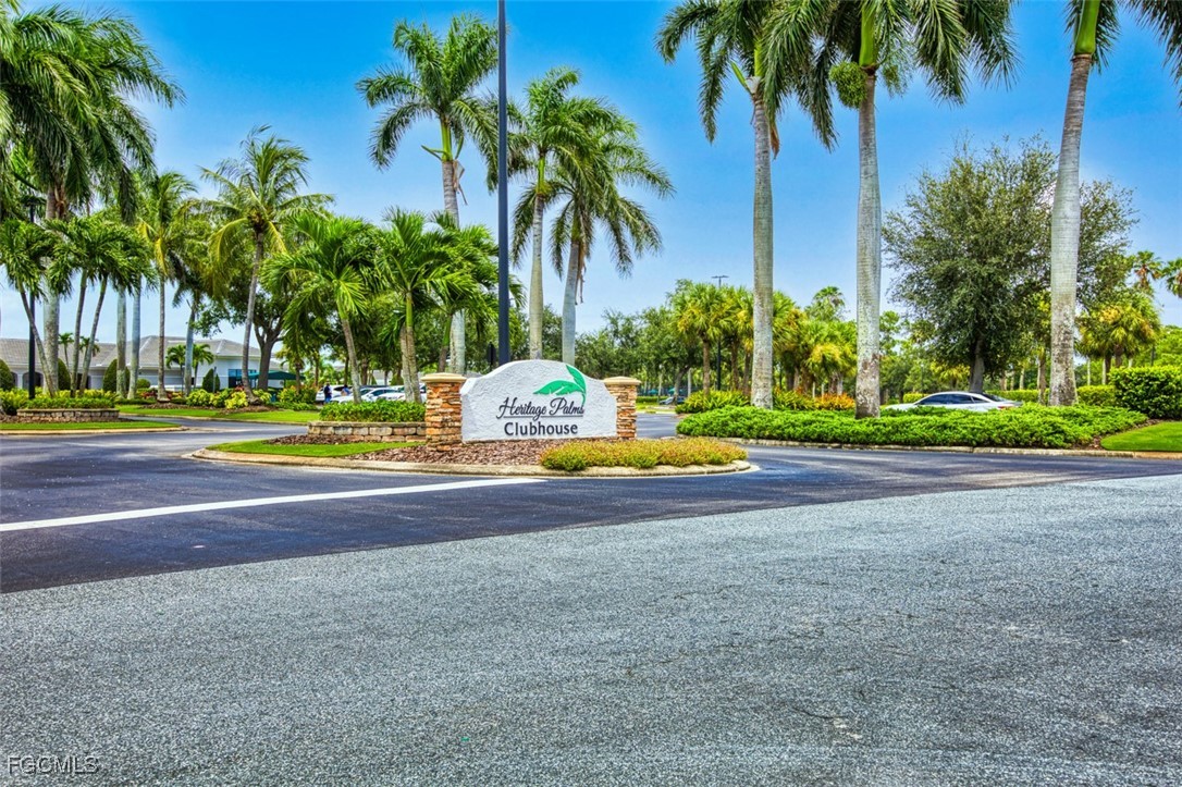 10275 Bismark Palm Way, Unit 1124 Fort Myers, FL 33966 - Photo 34 of 50 a view of a swimming pool with palm trees