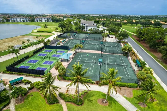 a front view of multiple houses with yard