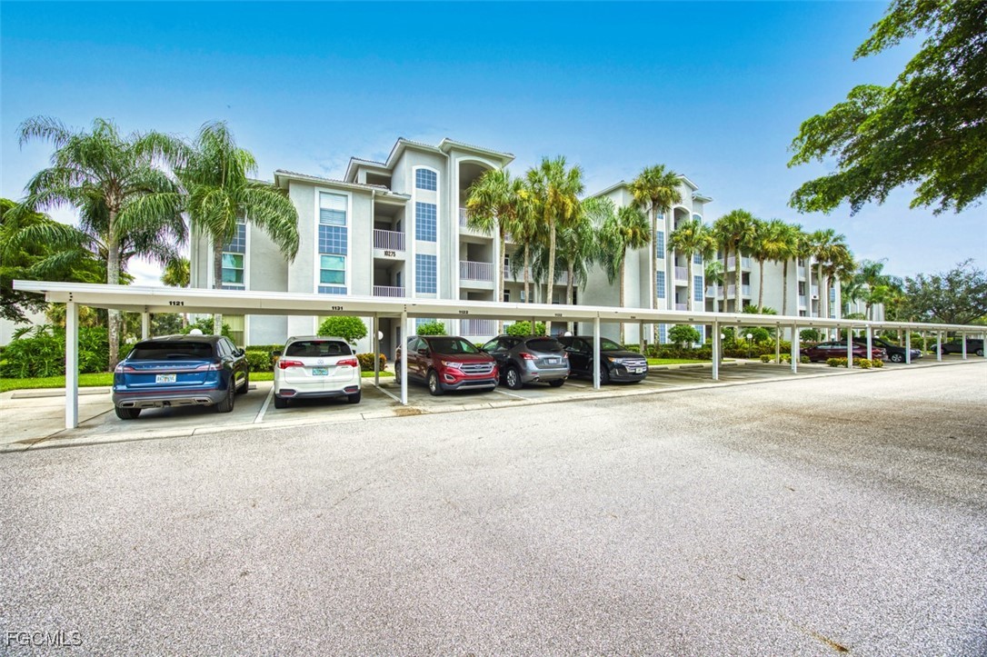 10275 Bismark Palm Way, Unit 1124 Fort Myers, FL 33966 - Photo 4 of 50 a view of a street with cars