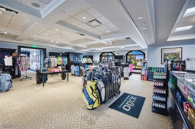 a view of a patio with a table chairs and a swimming pool