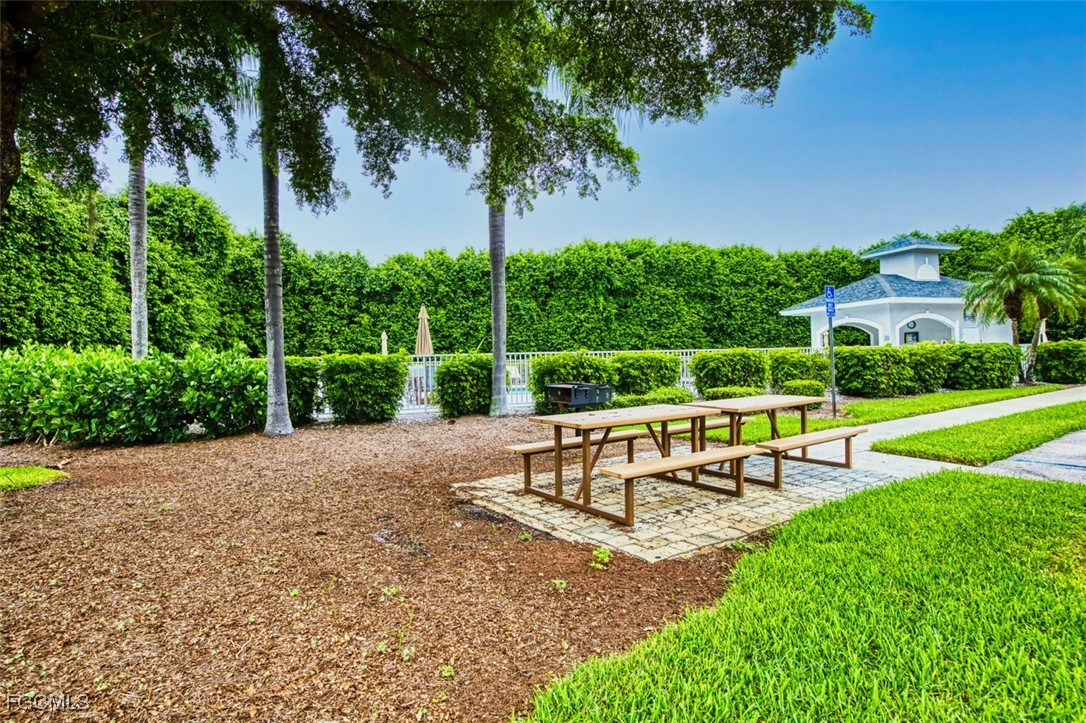 10275 Bismark Palm Way, Unit 1124 Fort Myers, FL 33966 - Photo 47 of 50 a view of a park with furniture and garden