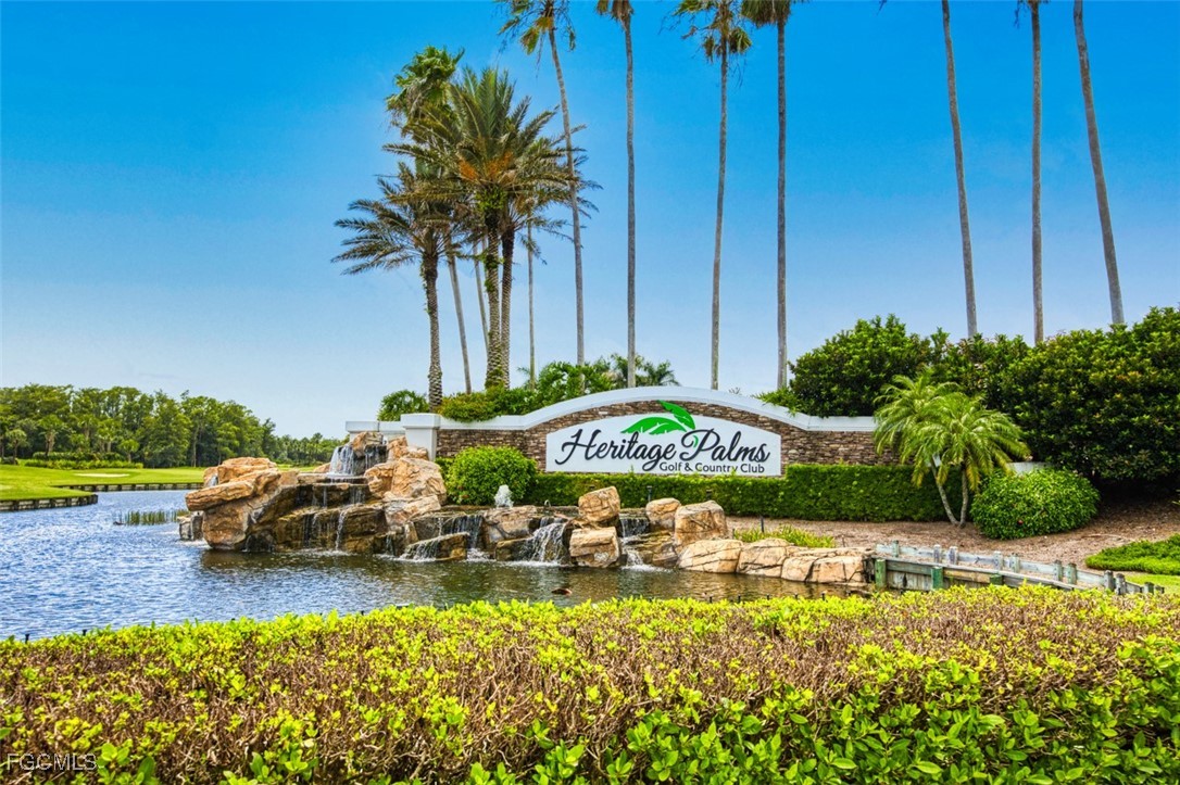 10275 Bismark Palm Way, Unit 1124 Fort Myers, FL 33966 - Photo 5 of 50 a front view of a house with garden and patio