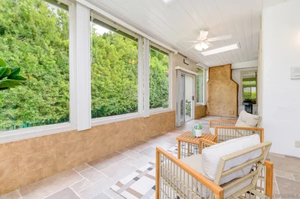 a view of a dining room with furniture window and outside view