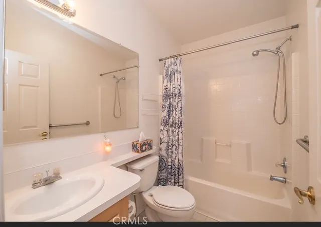 a bedroom with a bed dresser and a window