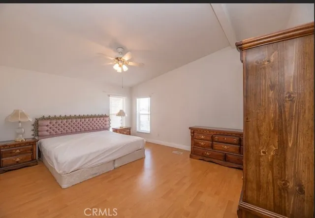 a bathroom with a sink a toilet a shower and a mirror