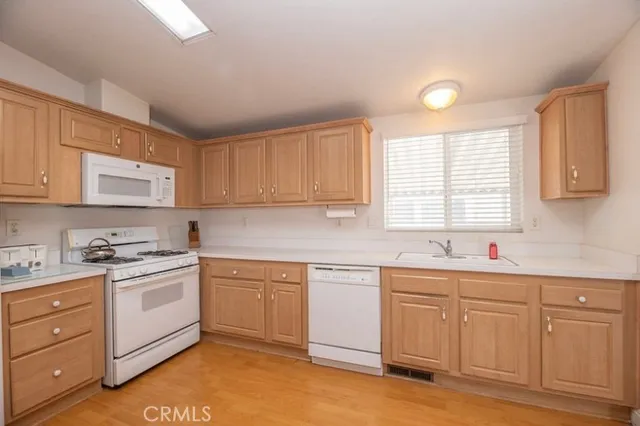 a kitchen with sink cabinets and window