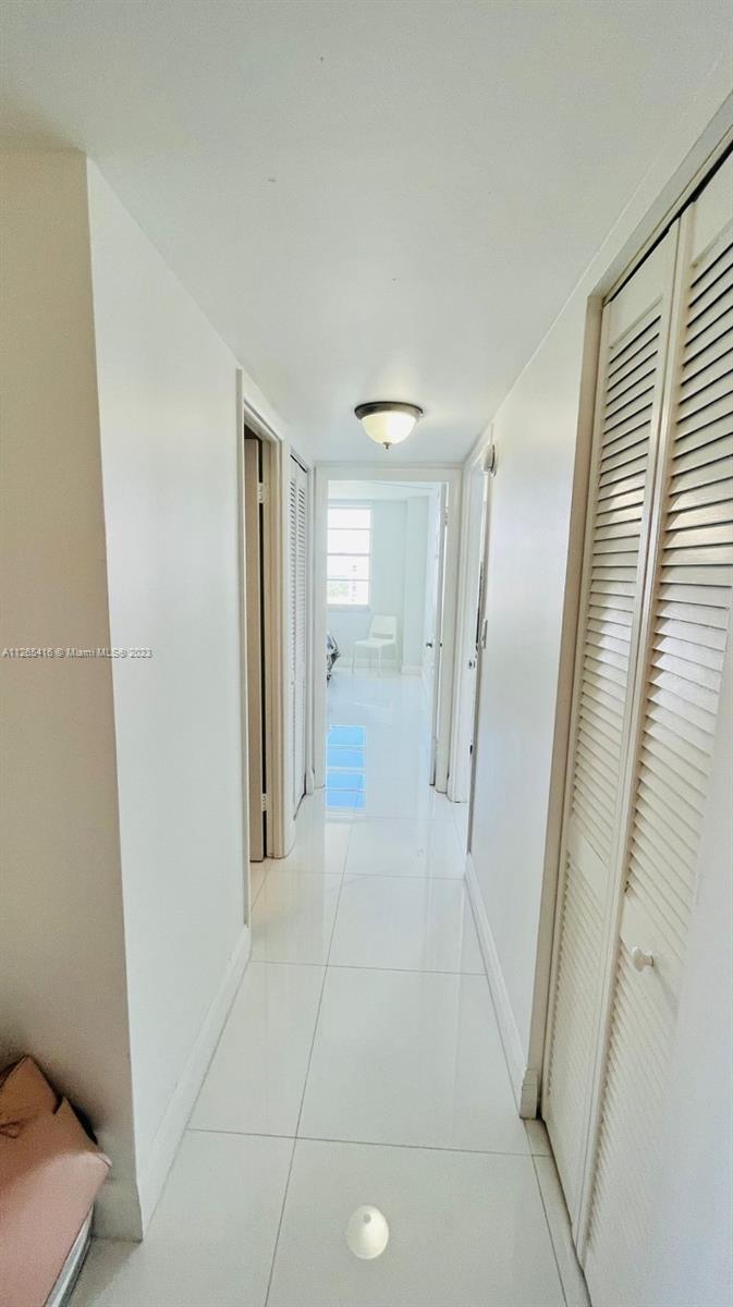 2851 Northeast 183rd Street, Unit 1816E Aventura, FL 33160 - Photo 17 of 29 a view of entryway with wooden floor