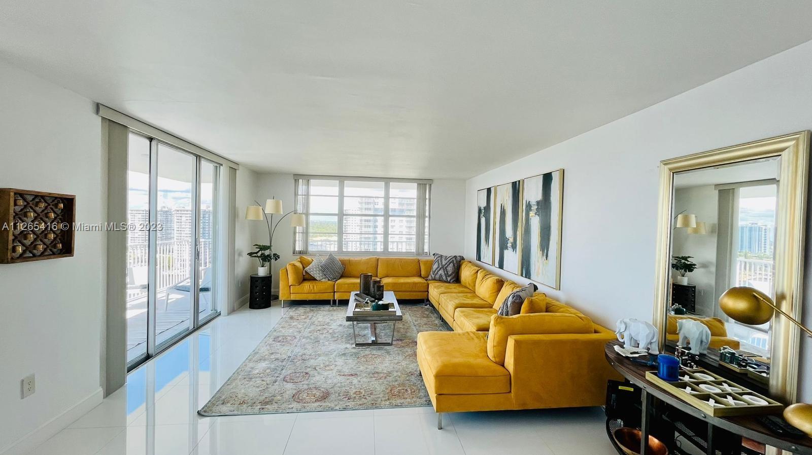 2851 Northeast 183rd Street, Unit 1816E Aventura, FL 33160 - Photo 2 of 29 a bedroom with furniture and a window