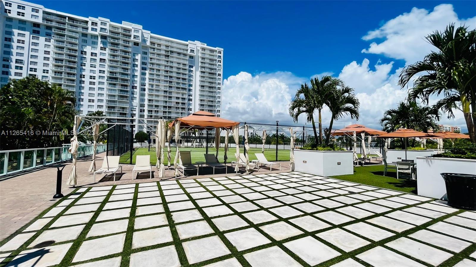 2851 Northeast 183rd Street, Unit 1816E Aventura, FL 33160 - Photo 29 of 29 a view of a street with plants