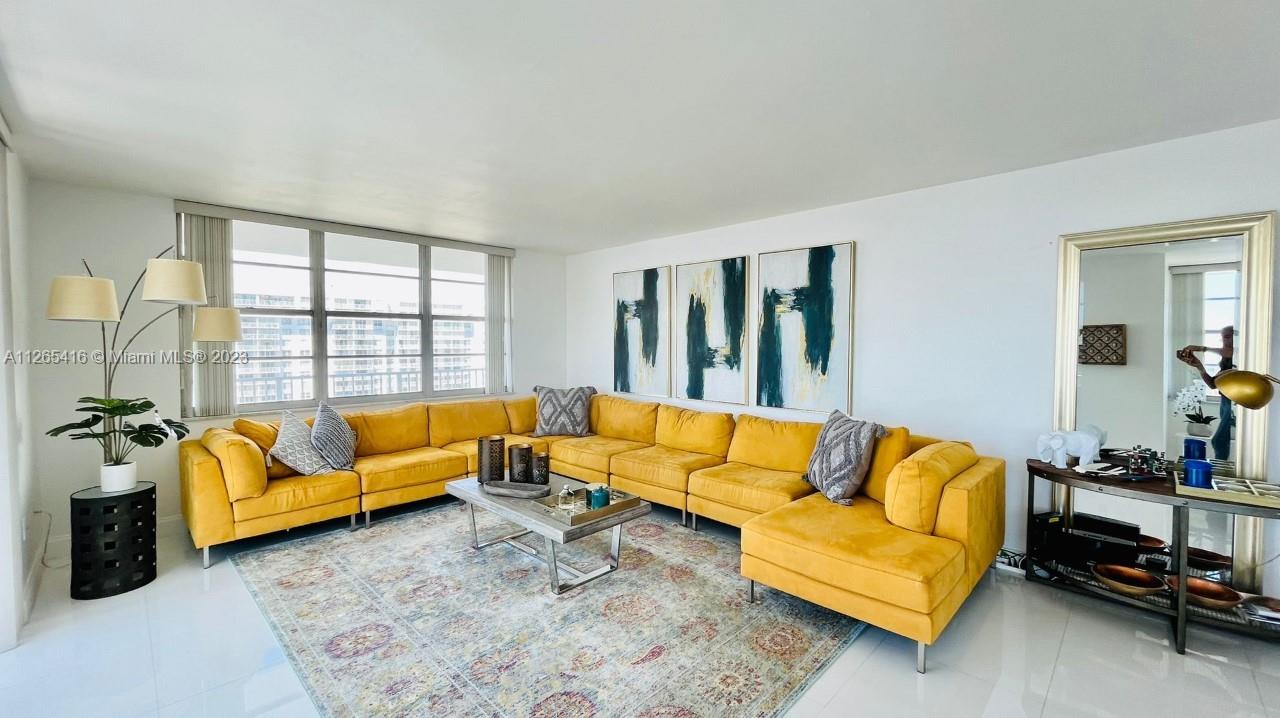 2851 Northeast 183rd Street, Unit 1816E Aventura, FL 33160 - Photo 3 of 29 a living room with furniture and a large window